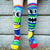 Monster Socks against Fence - MADMIA