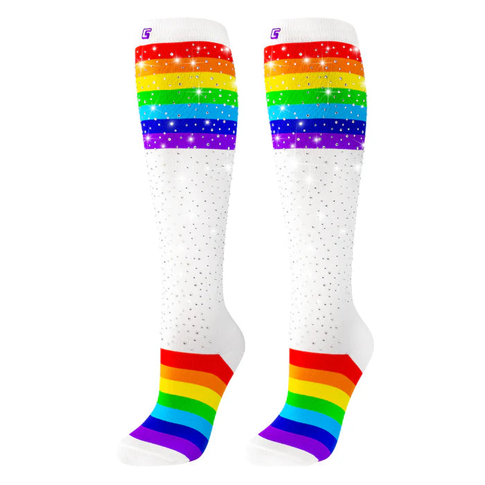 rainbow sparkly socks in field with rainbow