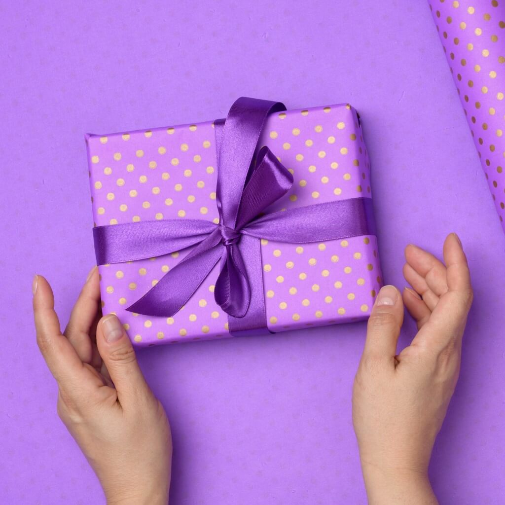 Gift Wrapped with Paper and Ribbon Tied in a Bow